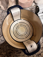 Five Oaks Farm dough sling for baking, shown with wooden handles and flexible silicone strap for easy dough handling.