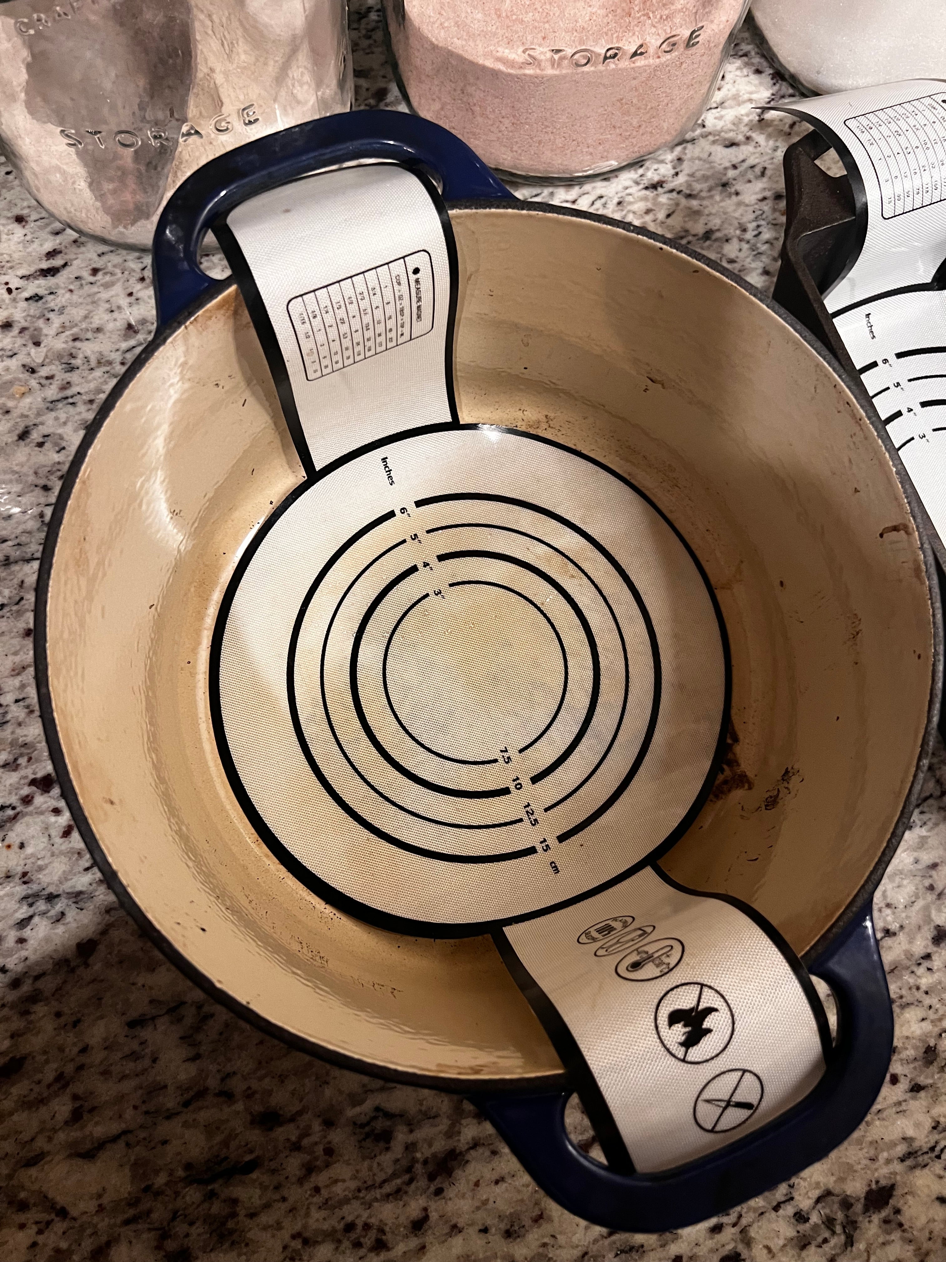 Five Oaks Farm dough sling for baking, shown with wooden handles and flexible silicone strap for easy dough handling.
