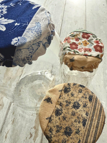 Set of Five Oaks Farm From the Farm mushroom-themed jar covers with autumn-inspired design on small jars.