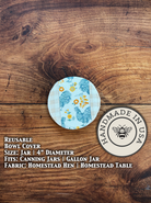 Homestead hen jar cover from Five Oaks Farm on a rustic table, showcasing a farm-inspired design for preserving jars.