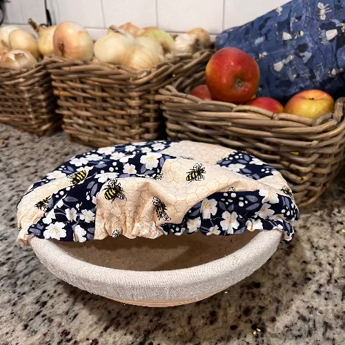 Small bowl and banneton covers from Five Oaks Farm, featuring autumn mushroom and tiny mushroom designs, for bread proofing and serving.