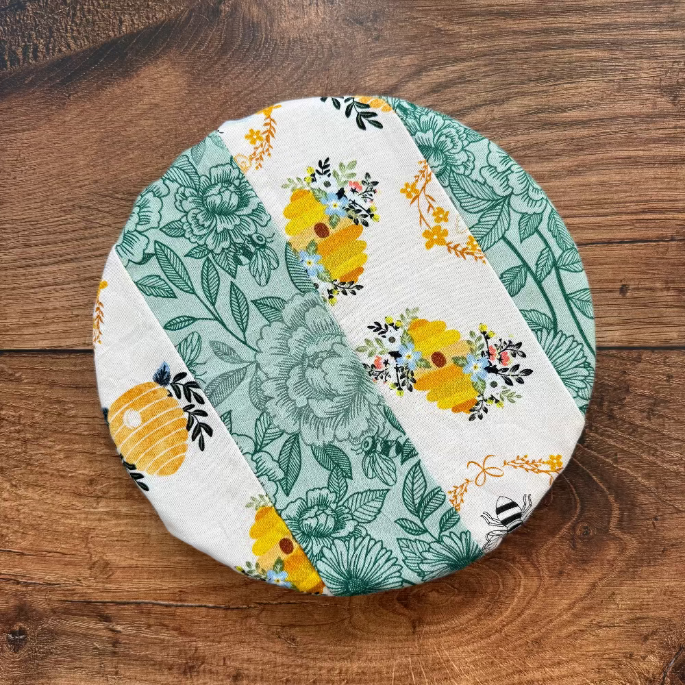 Small bowl and banneton covers from Five Oaks Farm, featuring autumn mushroom designs, used for baking and bread proofing.