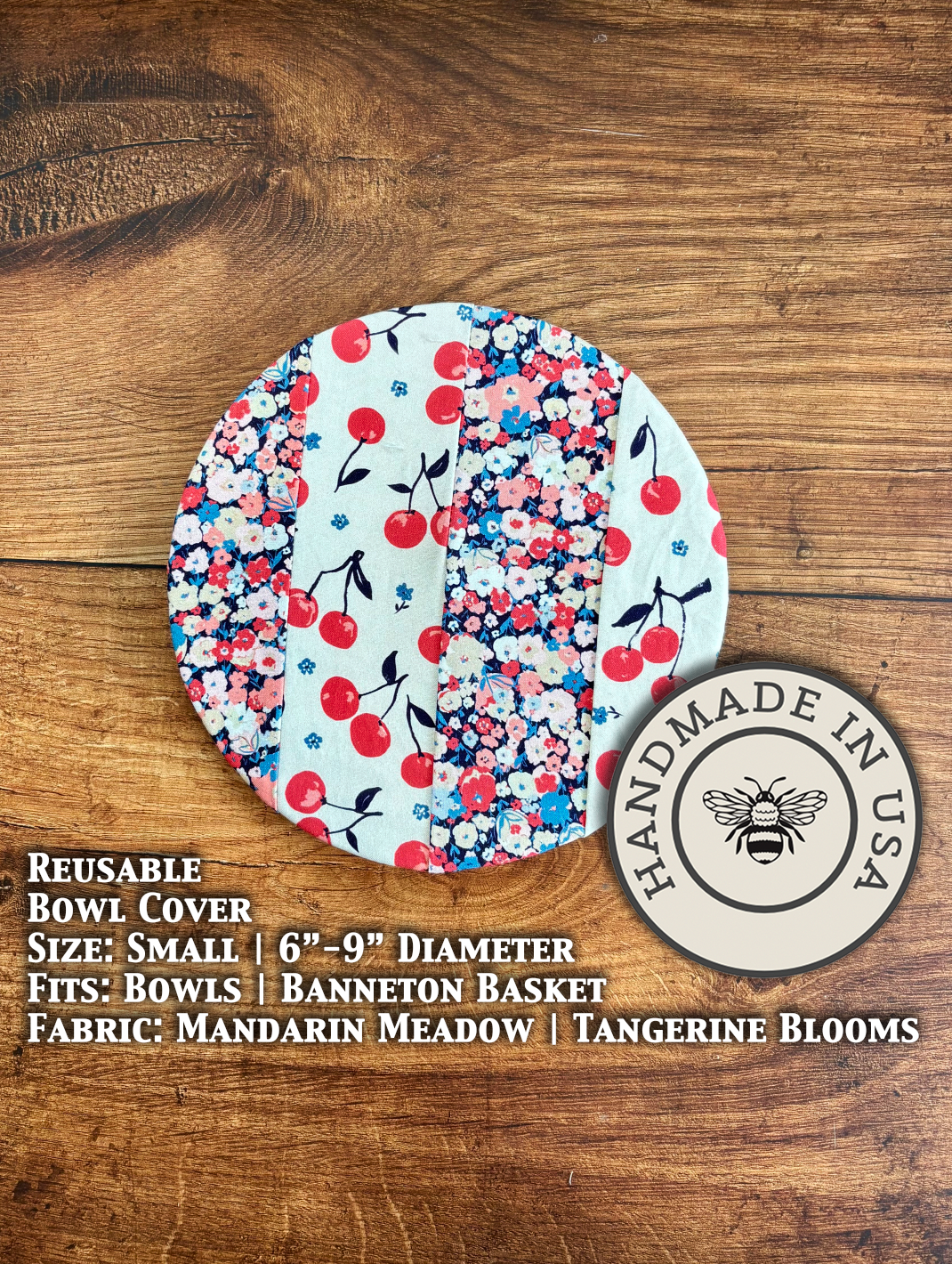 Small bowl and banneton covers from Five Oaks Farm with cherries and cream, set in a vibrant garden scene.