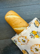 Beeswaxed Baguette bag from Five Oaks Farm featuring floral design, made from natural beeswaxed material, with a rustic farm style.