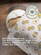Beeswaxed bread bag from Five Oaks Farm, green fabric with natural beeswax coating, ideal for storing fresh bread.