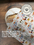 Beeswaxed bread bag from Five Oaks Farm with green fabric and natural beeswax coating for storing bread.