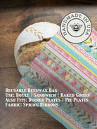 Beeswaxed bread bag from Five Oaks Farm, made of natural fabric, with green beeswax coating for fresh bread storage.
