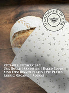 Beeswaxed bread bag from Five Oaks Farm, green fabric with natural beeswax coating, designed for storing fresh bread.