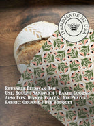 Beeswaxed bread bag from Five Oaks Farm, natural green fabric with beeswax coating, for storing fresh bread.