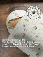 Beeswaxed bread bag from Five Oaks Farm with green fabric and natural beeswax coating, designed for storing fresh bread.