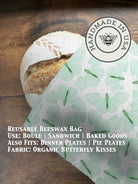 Beeswaxed bread bag from Five Oaks Farm, green fabric with natural beeswax coating, ideal for storing fresh bread.
