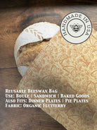 Beeswaxed bread bag from Five Oaks Farm with green fabric and natural beeswax coating, designed for storing fresh bread.