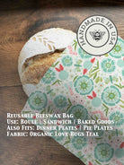 Beeswaxed bread bag from Five Oaks Farm, natural green fabric with beeswax coating, ideal for storing freshly baked bread.