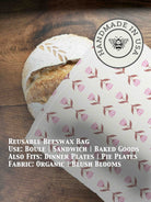 Beeswaxed bread bag from Five Oaks Farm, made of natural fabric with green beeswax coating for bread storage.