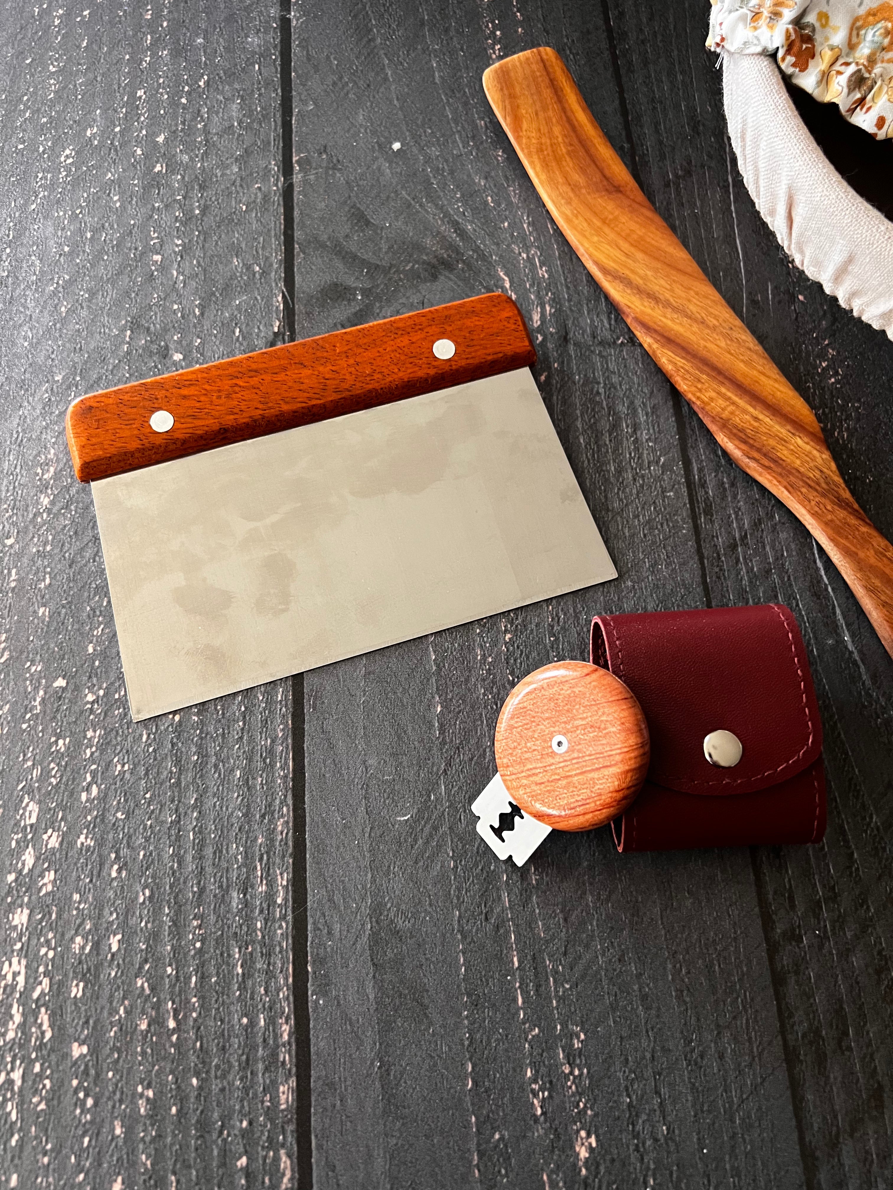 Farm-style bench scraper from Five Oaks Farm, with a sturdy handle and flat blade for food prep and dough cutting.