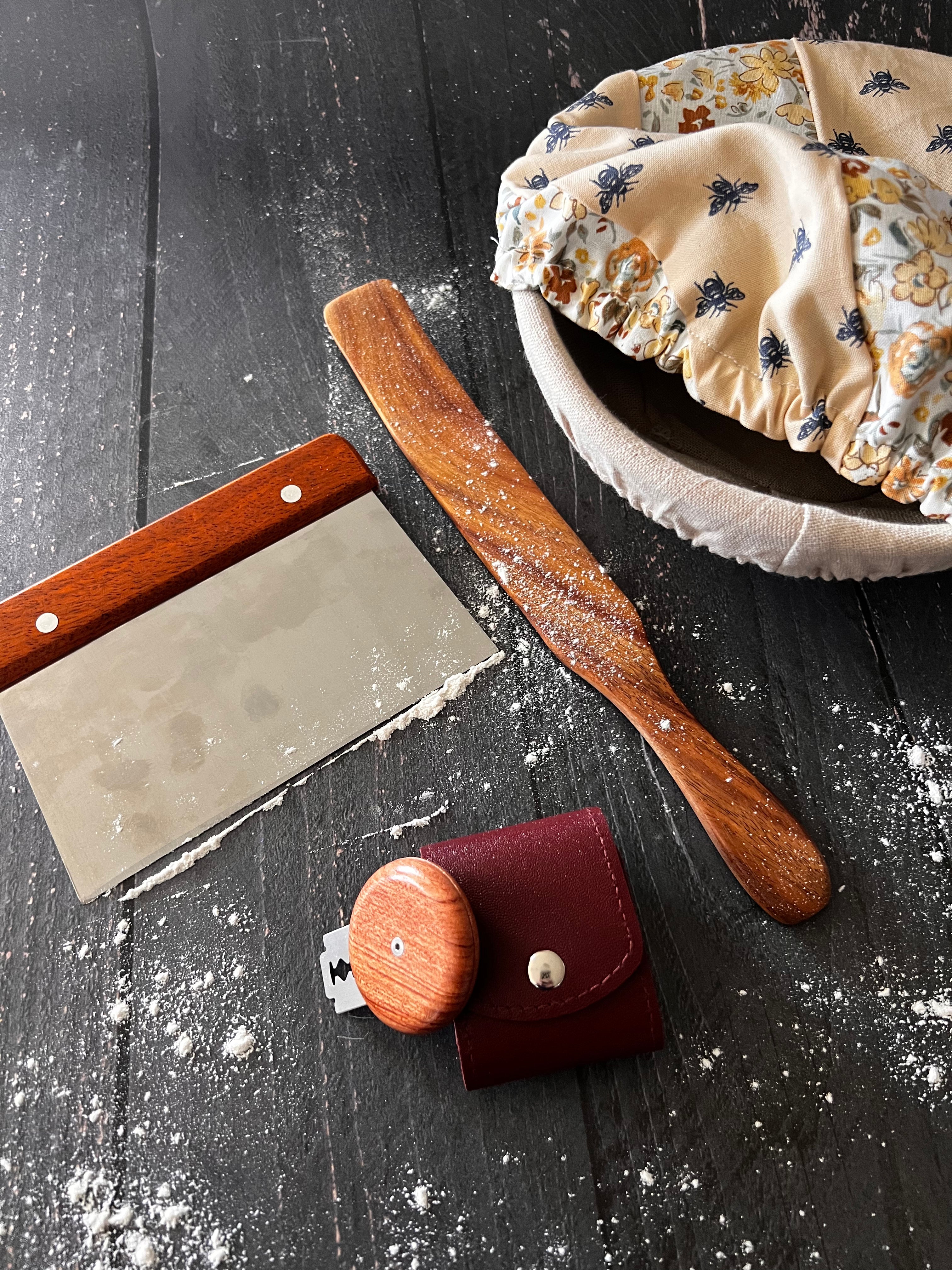 Five Oaks Farm Bench Scraper from the Farm, a durable kitchen tool with a wooden handle and stainless steel blade.