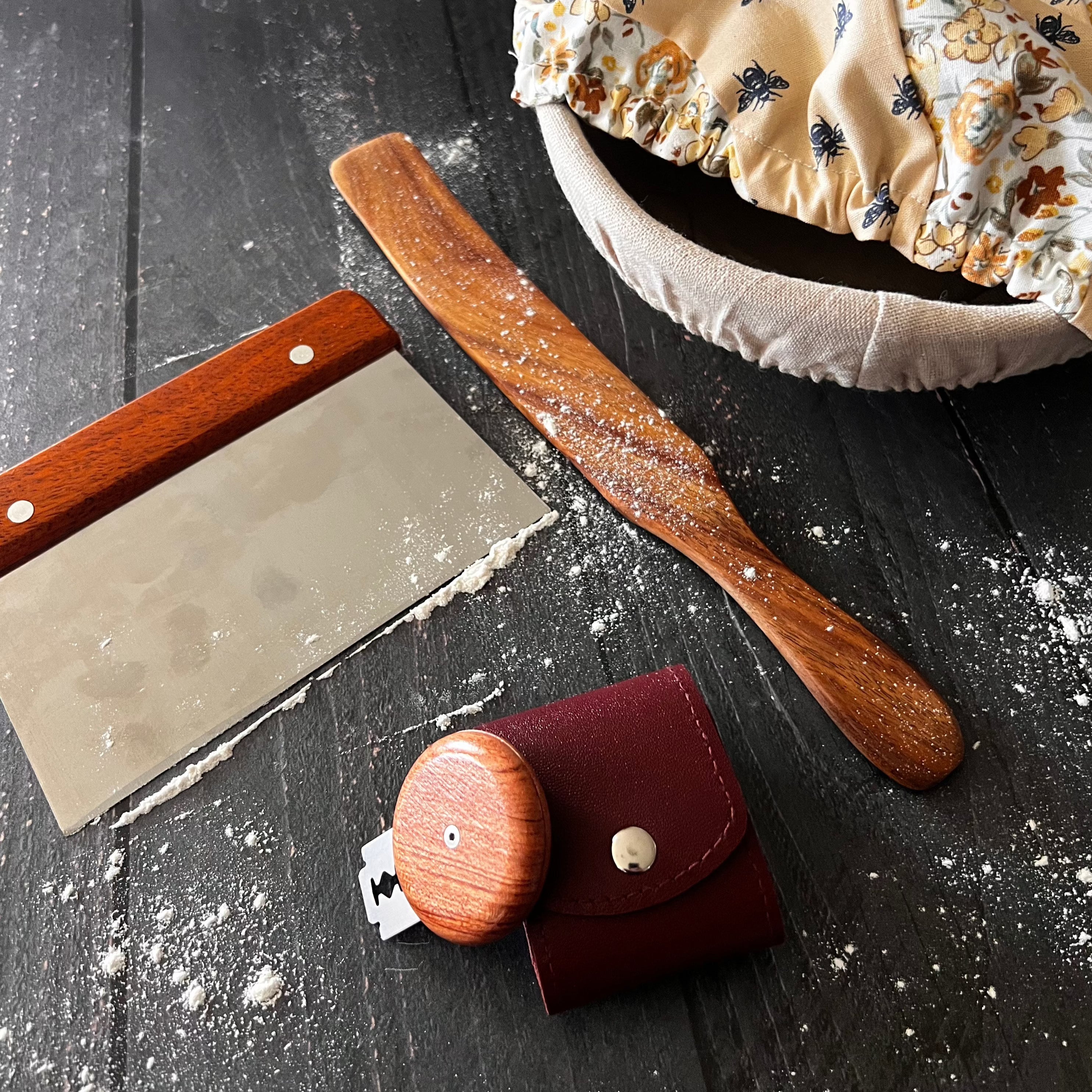 From the Farm bread lame scoring tool by Five Oaks Farm, featuring a wooden handle and sharp blade for scoring bread dough.