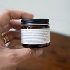 Frankencense Tallow Balm from Five Oaks Farm showing the jar with balm and natural ingredients visible inside.