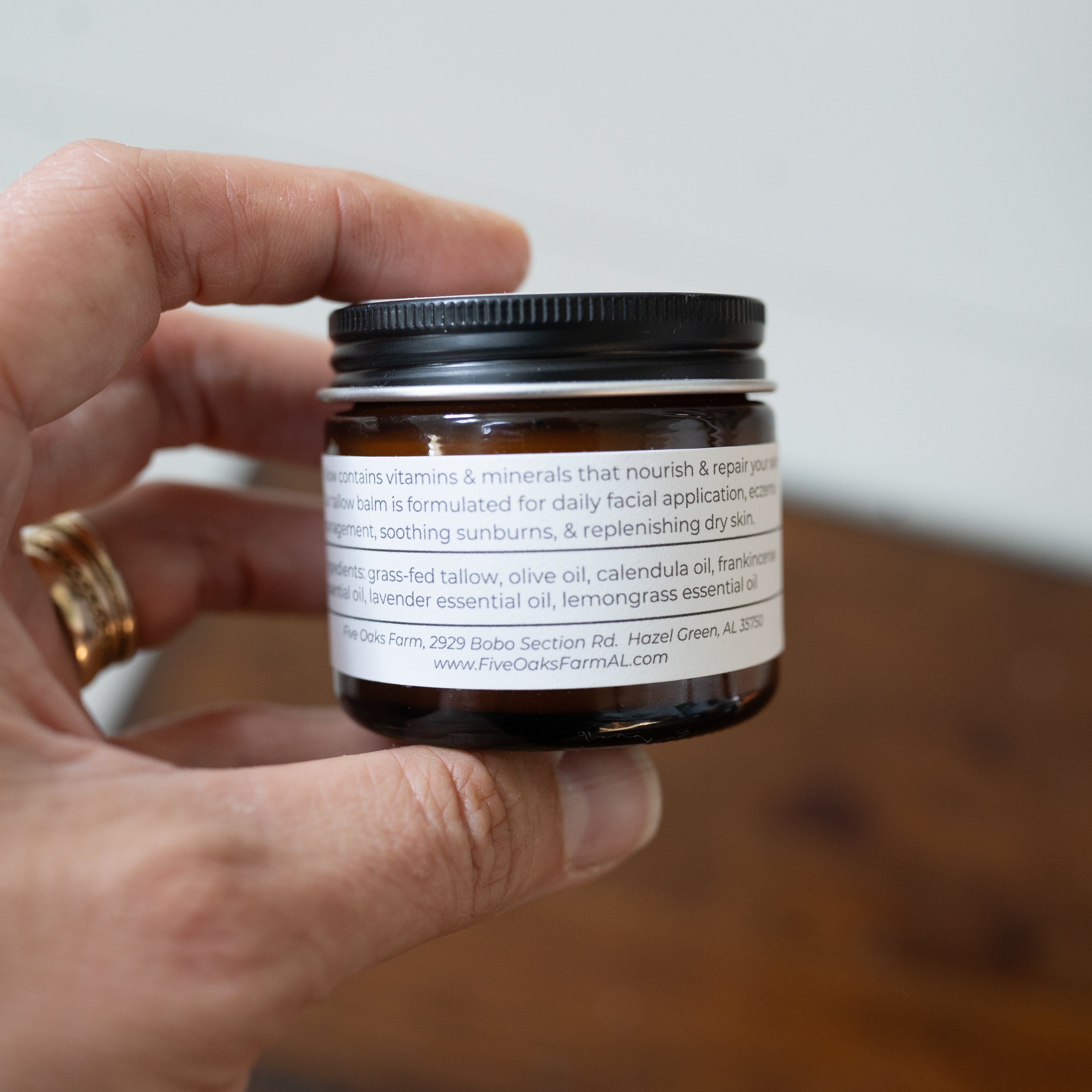 Frankencense Tallow Balm from Five Oaks Farm showing the jar with balm and natural ingredients visible inside.