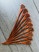 Honey spoon from Five Oaks Farm, natural wooden utensil for serving honey, with a smooth handle and rounded scoop.