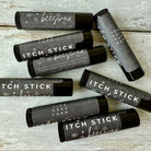 Five Oaks Farm Itch Stick from the Farm, natural remedy for skin irritation, shown in a close-up of the product tube.