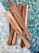 Wooden Spurtle from Five Oaks Farm, handcrafted kitchen utensil for stirring and mixing in cooking and baking.