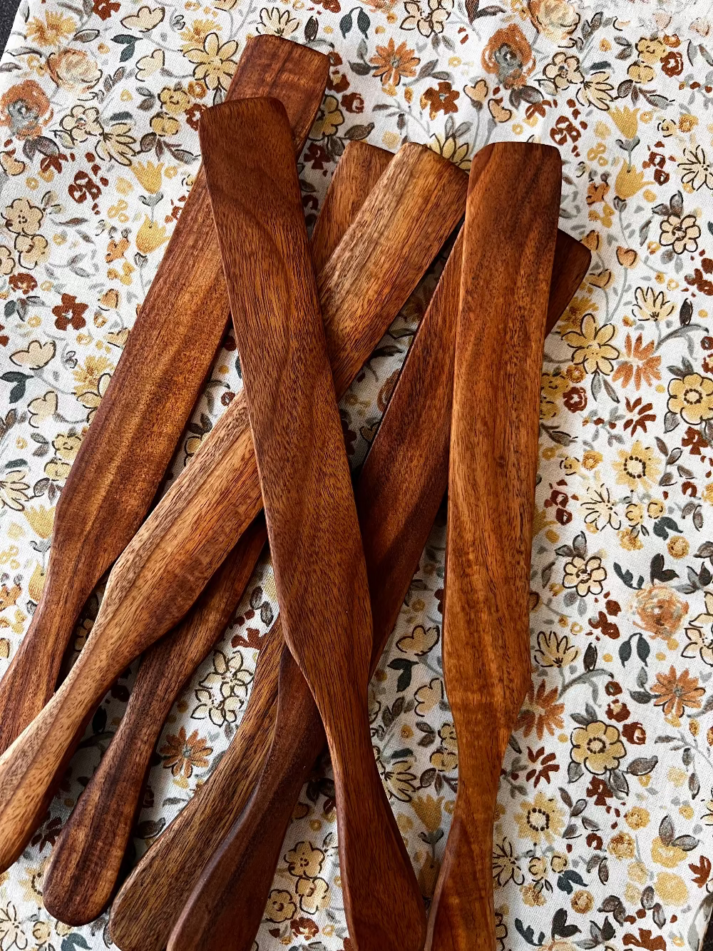 Rustic wooden Spurtle from Five Oaks Farm, handcrafted kitchen utensil for stirring and cooking with natural wood finish.