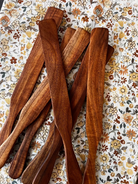 Rustic wooden Spurtle from Five Oaks Farm, handcrafted kitchen utensil for stirring and cooking with natural wood finish.