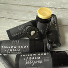 Two jars of Five Oaks Farm Tallow Body Balm from the farm, showing creamy texture and natural packaging.