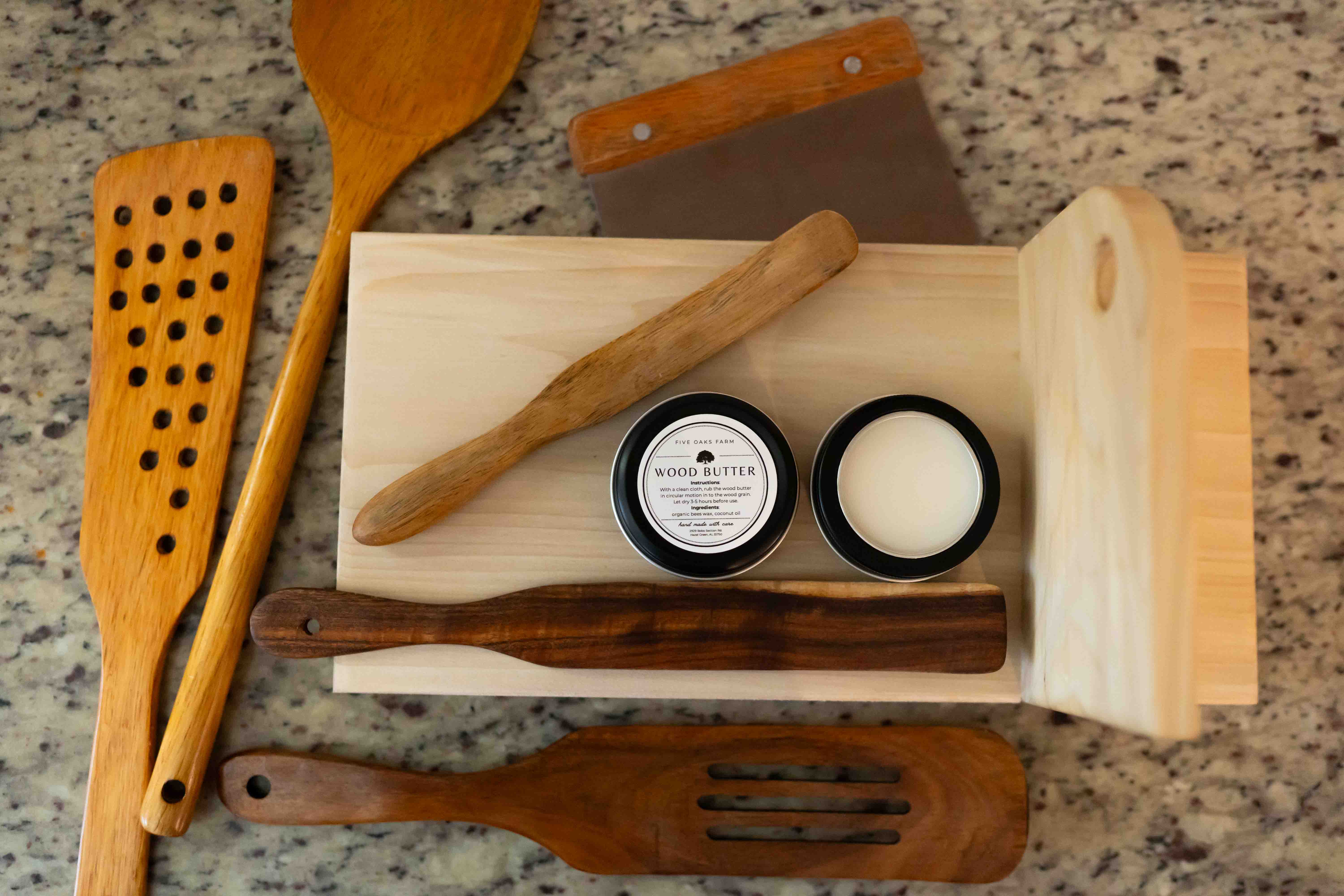 Natural wood butter from Five Oaks Farm, showcasing a jar of handcrafted wood conditioner with a rustic label.