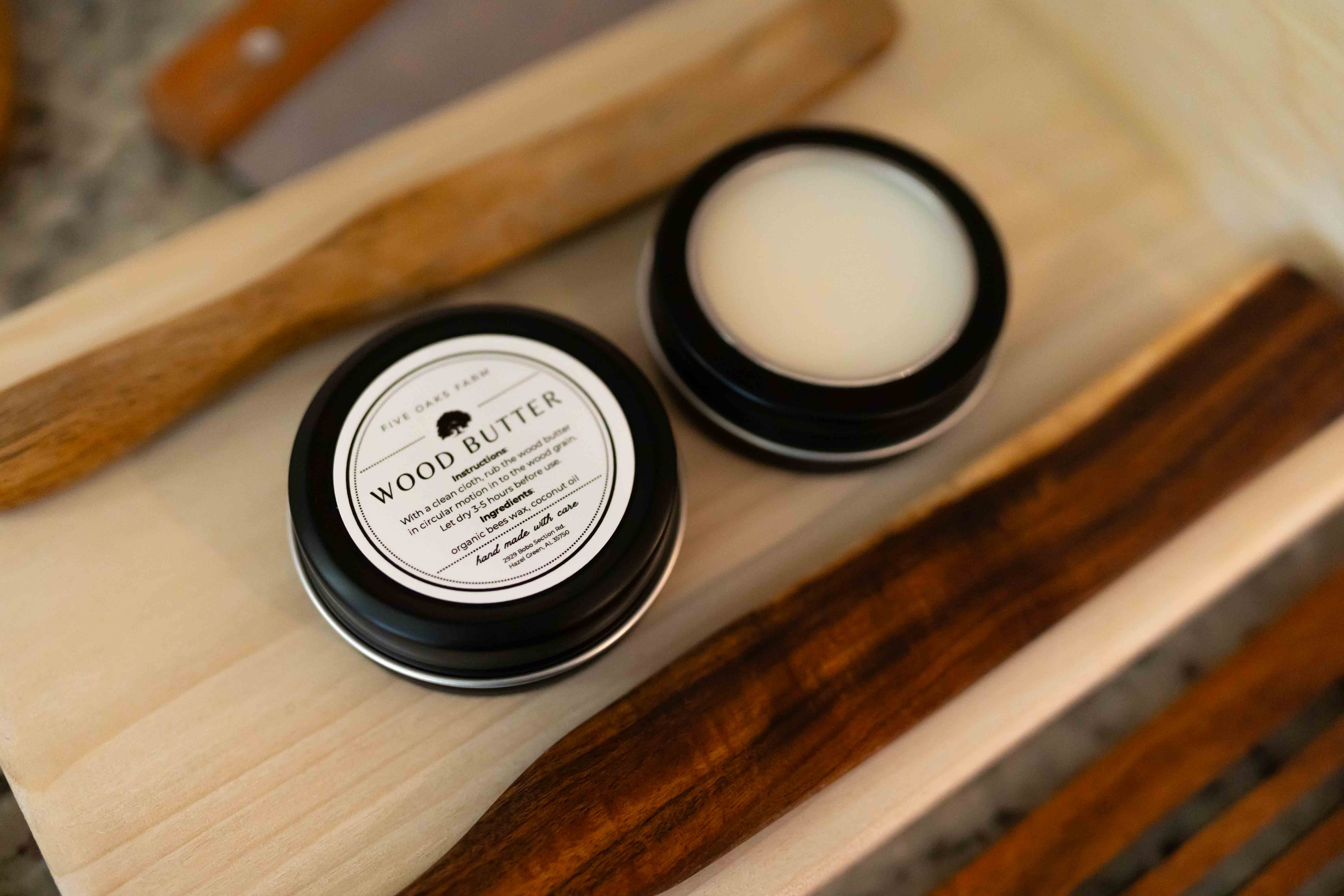 Creamy wood butter from Five Oaks Farm, natural treatment for wooden furniture and decor, showing a jar of wood conditioner.