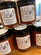 Five Oaks Farm Flavor Dust shaker showing colorful spice blend from the farm for enhancing food flavors.