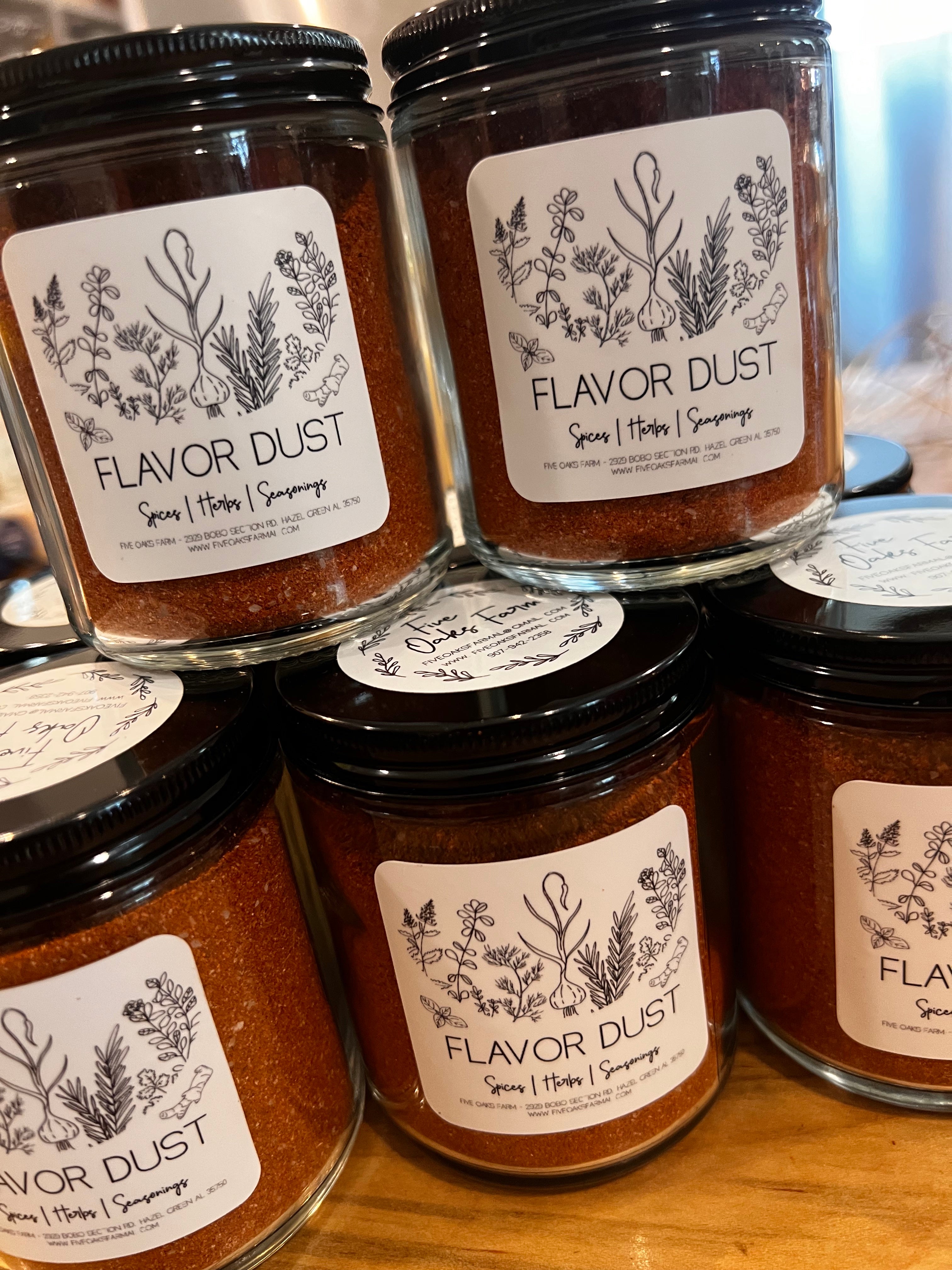 Five Oaks Farm Flavor Dust shaker showing colorful spice blend from the farm for enhancing food flavors.