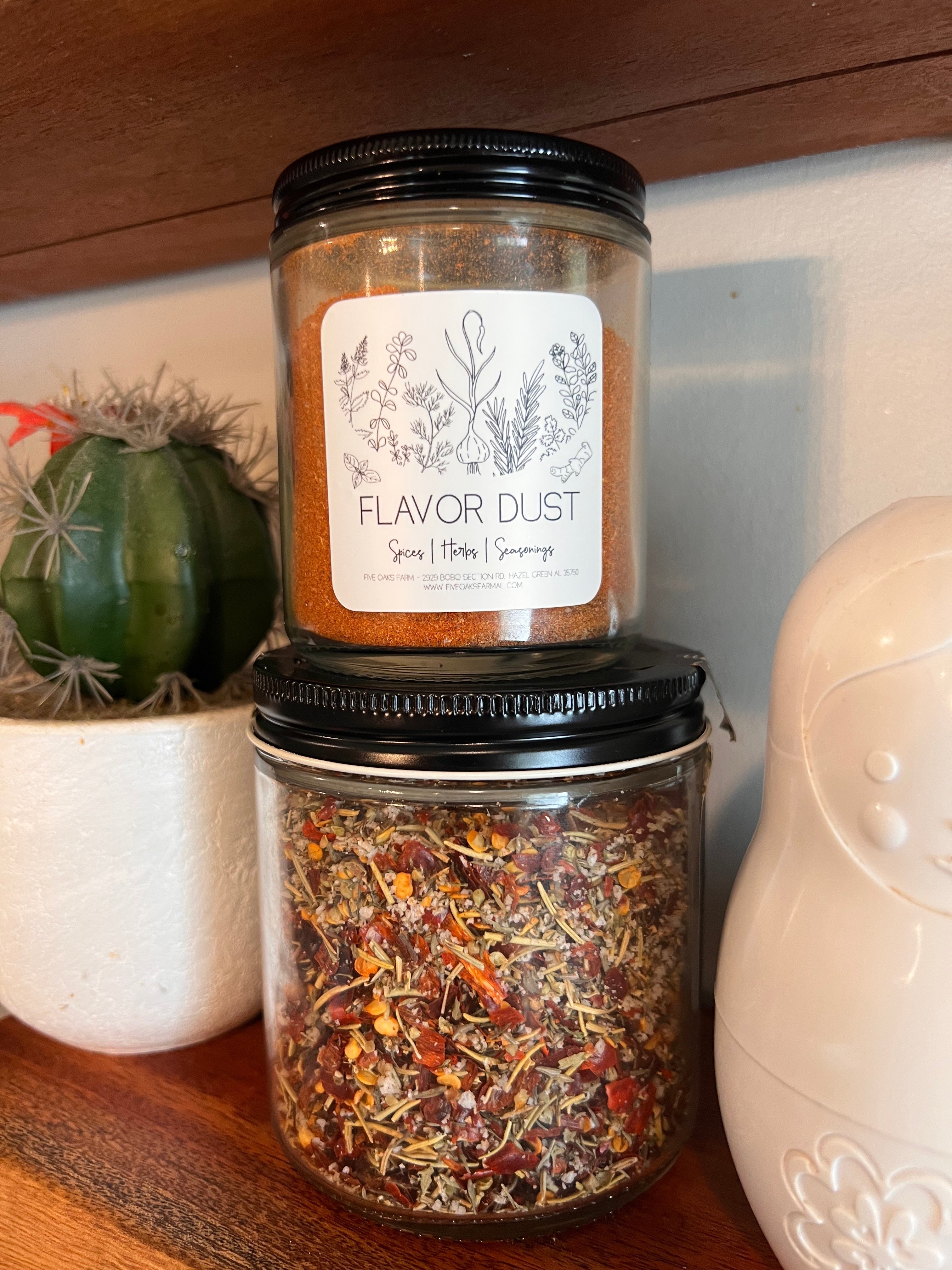 Five Oaks Farm From the Farm Flavor Dust shaker with savory seasoning, showcasing the rustic, natural spice blend in a clear jar.