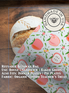 Organic cotton bread bag by Five Oaks Farm with beeswax coating, designed for storing fresh bread from the farm.