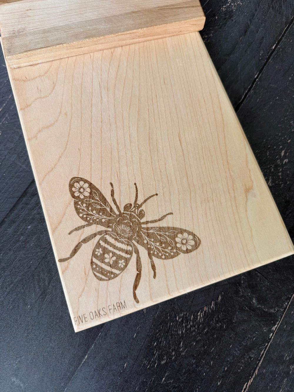 Vertical maple cutting board from Five Oaks Farm with a smooth surface and sturdy construction, ideal for kitchen use.