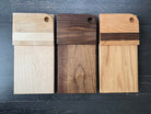 Maple vertical cutting board by Five Oaks Farm with natural wood grain and sturdy design for kitchen use.