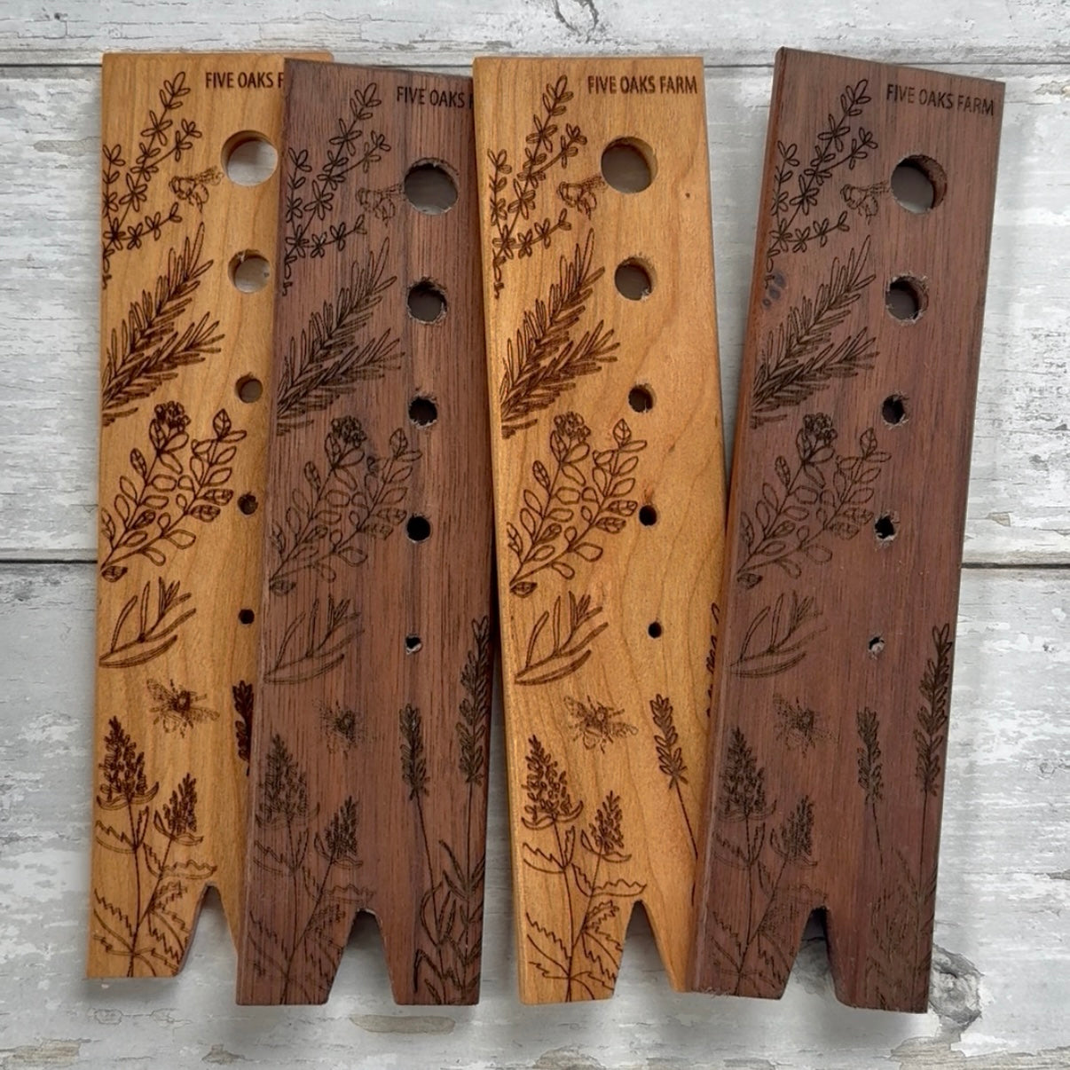 Walnut herb stripper from Five Oaks Farm with multiple openings for easily stripping herbs like thyme and rosemary.