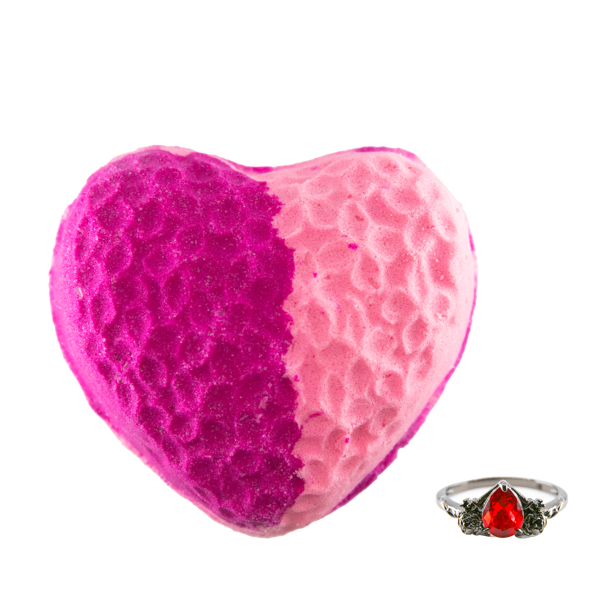 Fragrant Jewels Wicked Love bath bomb with a ring inside, shown in a soft pink color, designed for relaxing bath experiences.