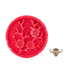Fragrant Jewels Wuthering Heights bath bomb with a ring, round shape, and vibrant colors, designed for a relaxing bath experience.
