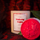 Fragrant Jewels Wuthering Heights bath bomb with a decorative ring, featuring a vibrant, colorful sphere for relaxing bath time.