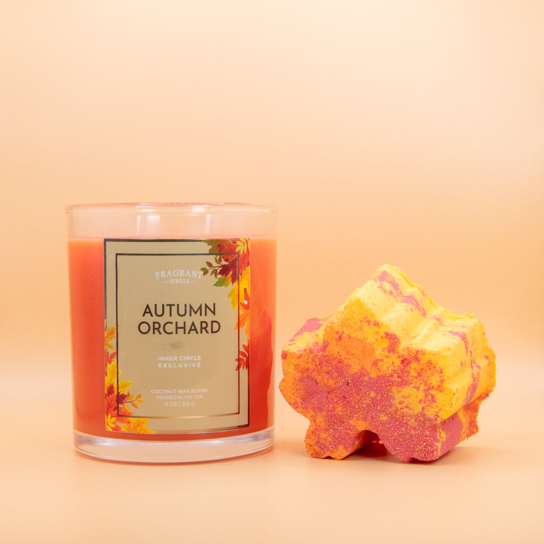 Fragrant Jewels Autumn Orchard candle and bath bomb bundle featuring a rhodium-plated ring, perfect for relaxing bath time.