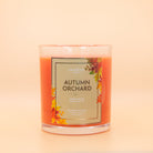 Fragrant Jewels Autumn Orchard candle and bath bomb bundle with a ring, featuring warm autumn scents and rhodium plating.