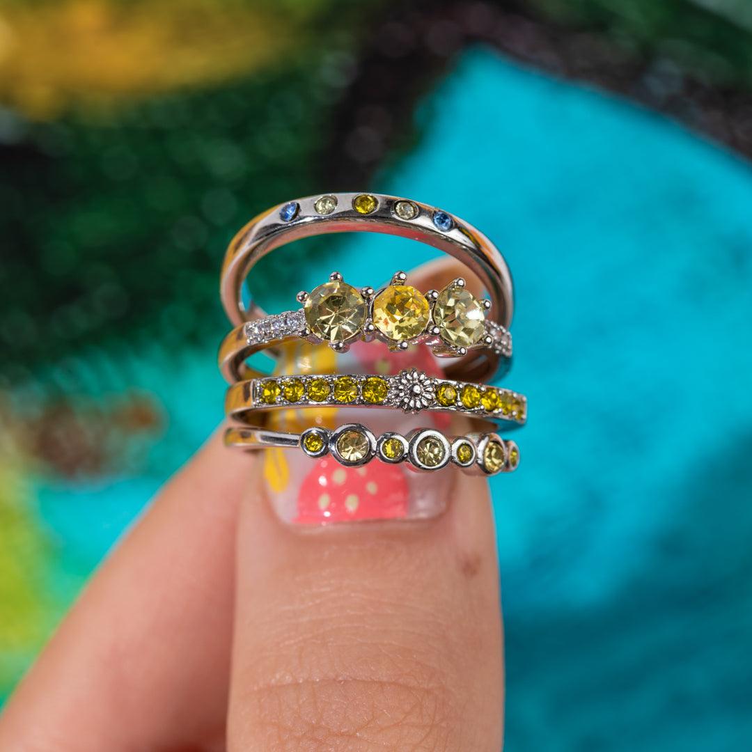 Jewel Candle by Fragrant Jewels featuring a sunflower design with a hidden ring inside, displayed with the candle and jewel visible.