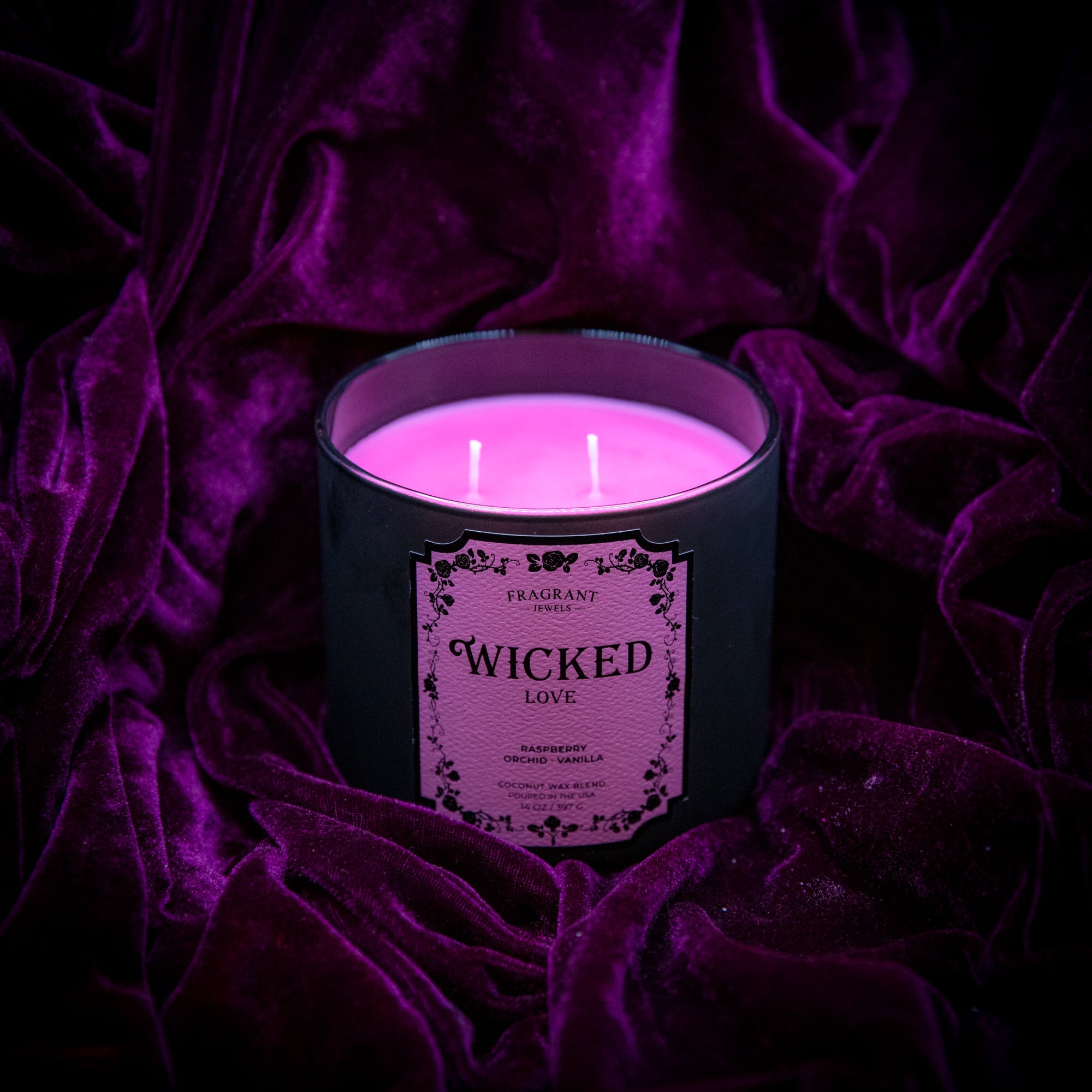 Fragrant Jewels Wicked Love Jewel Candle with embedded ring, featuring a luxurious wax candle in a decorative container.