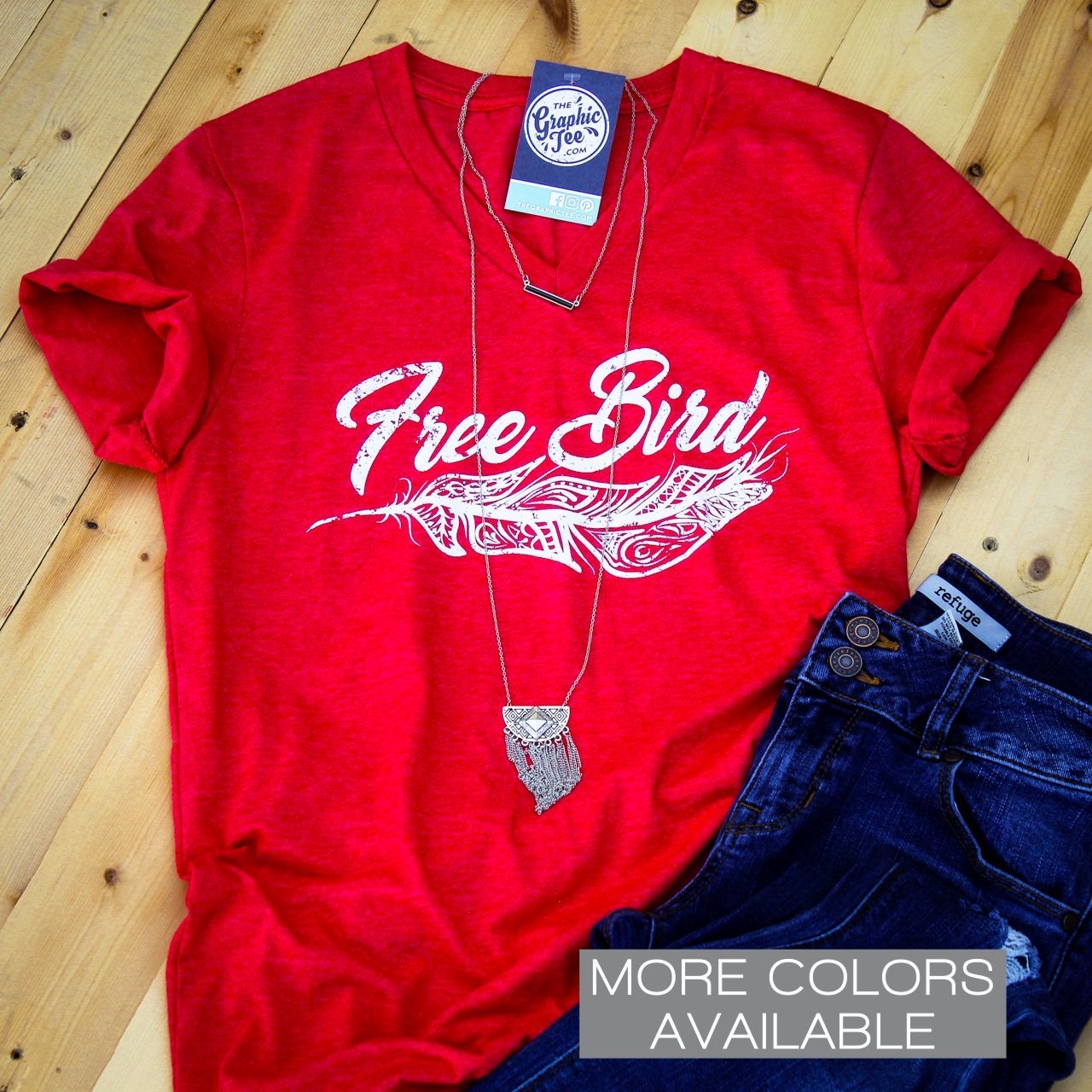 Unisex V-neck T-shirt featuring a graphic design with a free bird motif, from The Graphic Tee brand.