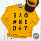Youth long sleeve gold graphic tee by The Graphic Tee featuring team logo and game day design on soft fabric.