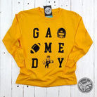 Youth long sleeve gold graphic tee from The Graphic Tee, featuring game day design and casual style.