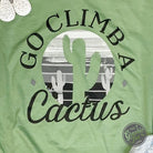 The Graphic Tee Go Climb A Cactus short sleeve graphic tee featuring a cactus design on soft fabric.