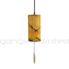 Blue moon and burgundy Single Zaphir Chimes by Gongs Unlimited with delicate metal tubes and wooden striker, hanging in a natural setting.